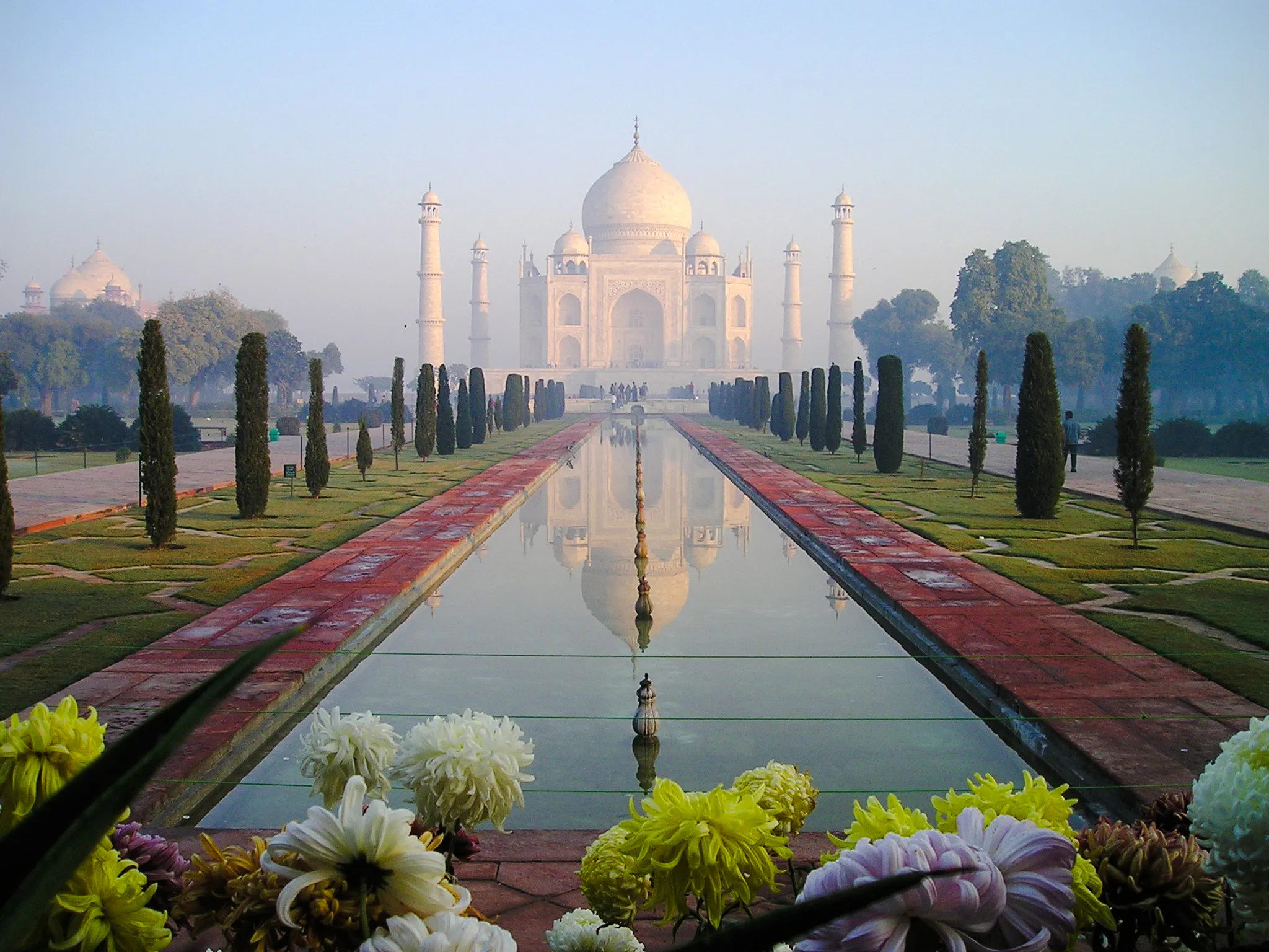 Taj Mahal reflecting in the central pool at sunrise, Agra, India.