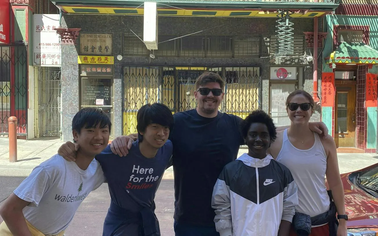 Group of people in front of a building in San Francisco Chinatown during a self-guided city exploration game.