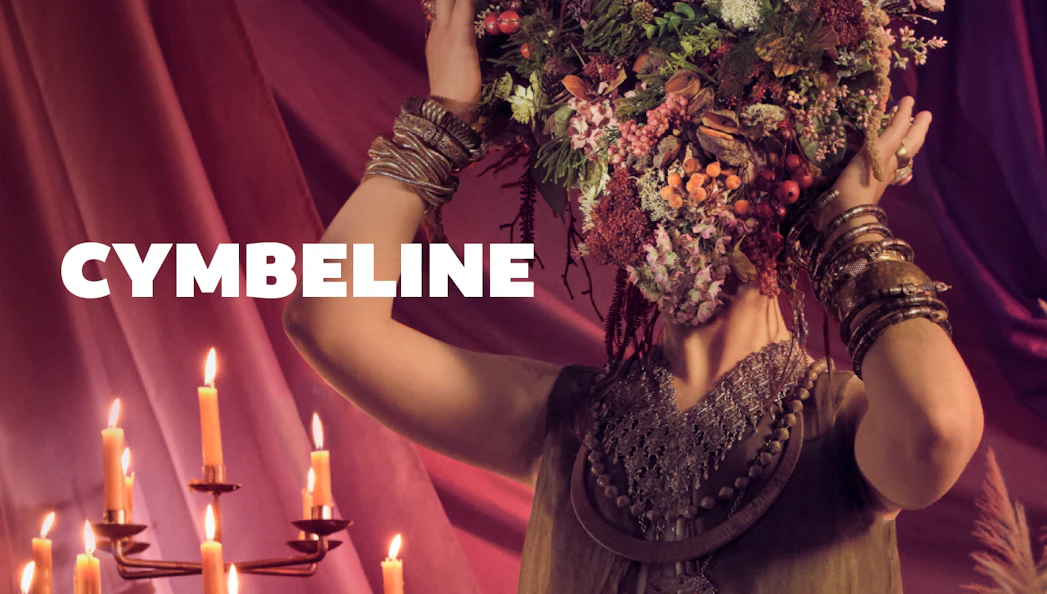Person with floral headdress and candles, related to Cymbeline.