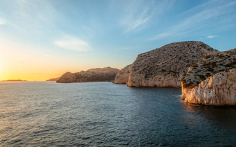 Marseille coastline at sunset during a dinner cruise.