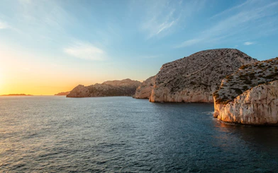 Marseille coastline at sunset during a dinner cruise.