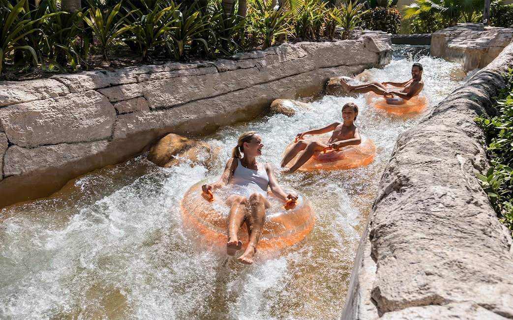 People enjoying a lazy river ride at Atlantis Aquaventure, Nassau, Bahamas.