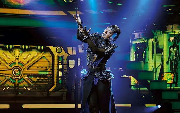Performer in futuristic costume on stage at Fantissima Dinner Show.