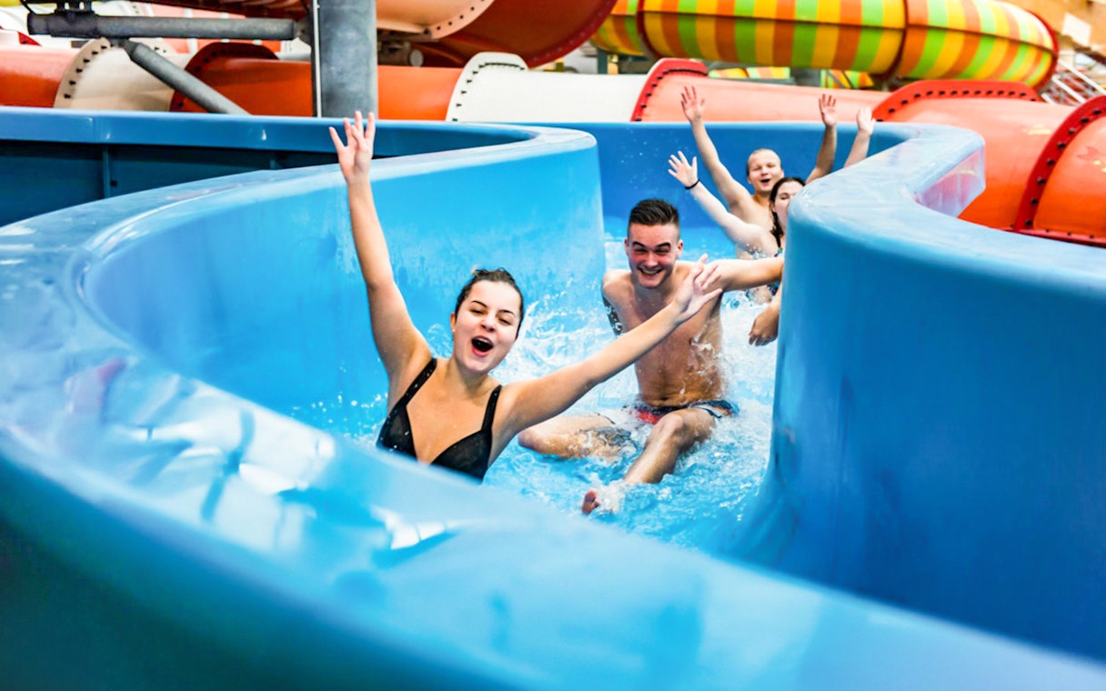 Visitors enjoying a water slide at Aquapalace Water World, Prague.