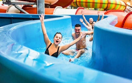 Visitors enjoying a water slide at Aquapalace Water World, Prague.