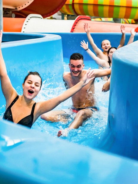 Visitors enjoying a water slide at Aquapalace Water World, Prague.