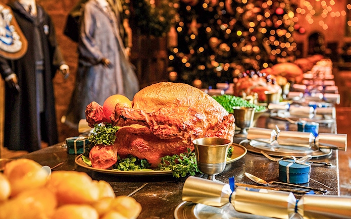 Festive feast setup at Warner Bros. Studio Tour Tokyo, featuring a roast turkey and holiday decor.