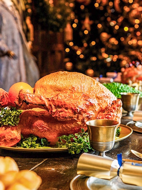 Festive feast setup at Warner Bros. Studio Tour Tokyo, featuring a roast turkey and holiday decor.
