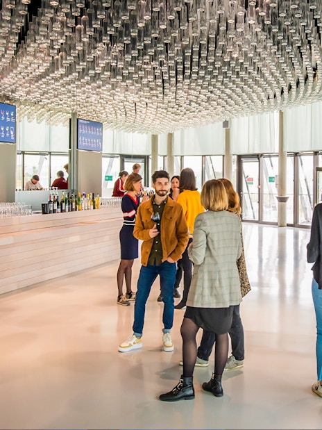 Visitors enjoying wine tasting at Cite du Vin's Belvedere in Bordeaux.