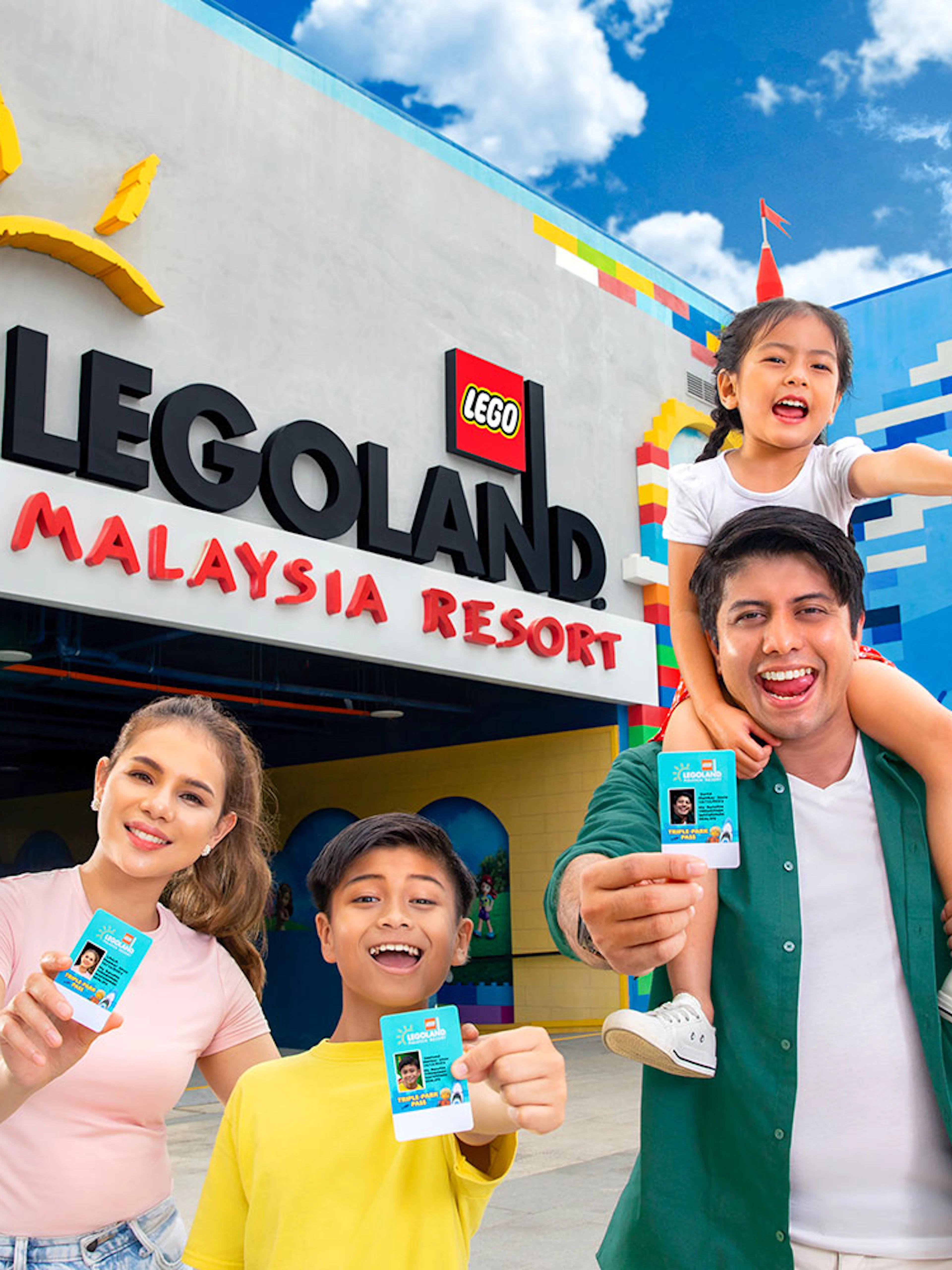 Family holding day passes at LEGOLAND Malaysia entrance.