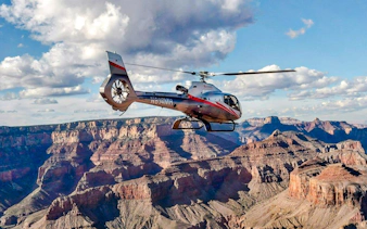 Helicopter flying over Grand Canyon South Rim.