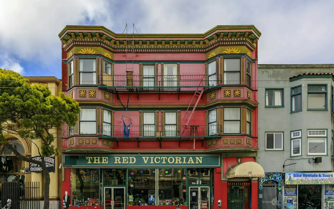 The Red Victorian building in Haight Ashbury, San Francisco, showcasing vibrant architecture.