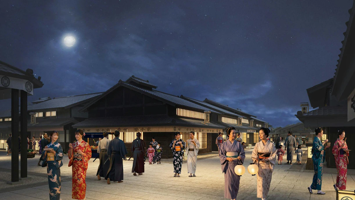 Night scene at TOEI Kyoto Studio Park with people in traditional attire.