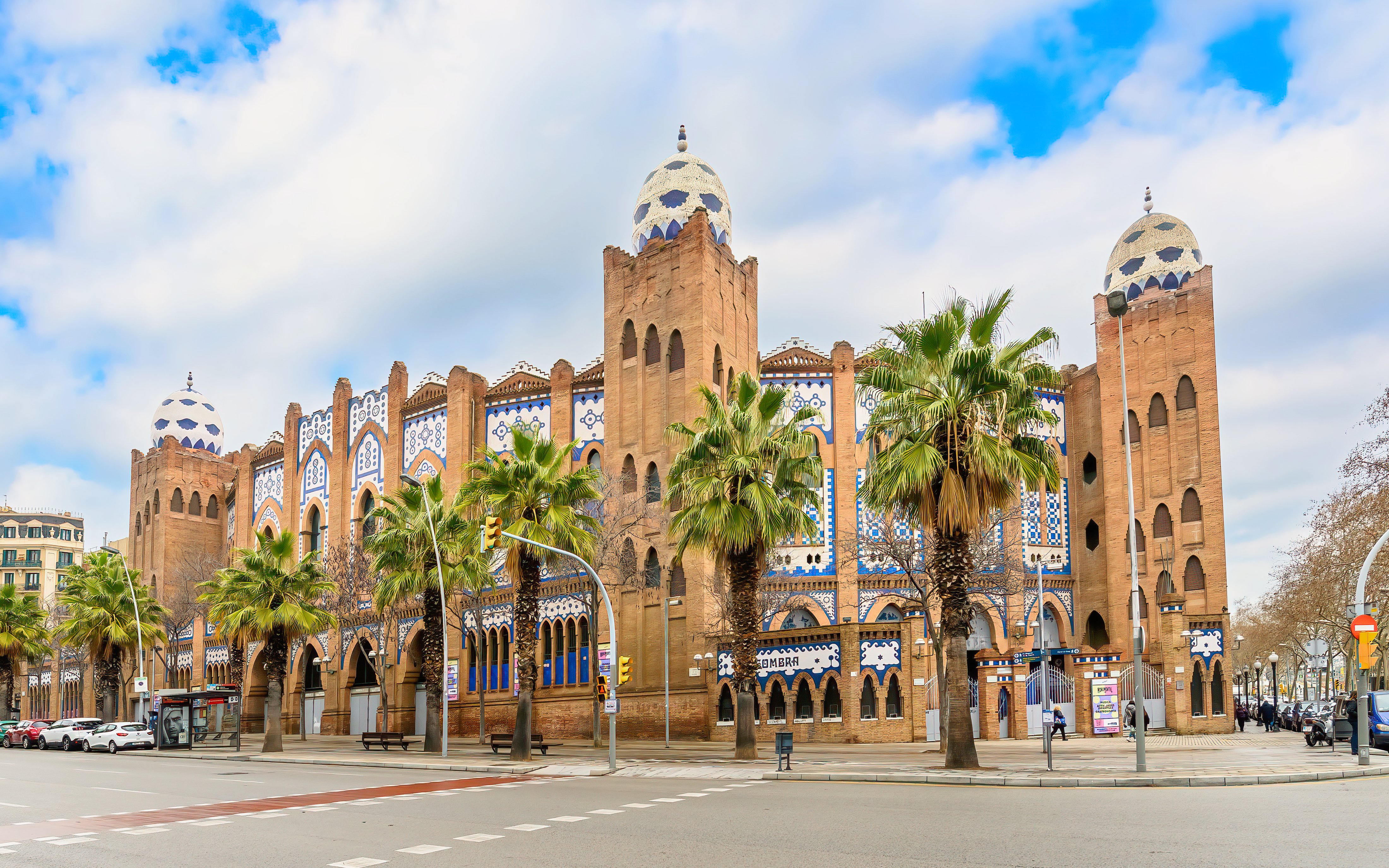 Plaza de Toros Monumental de Barcelona with Moorish architecture and palm trees.
