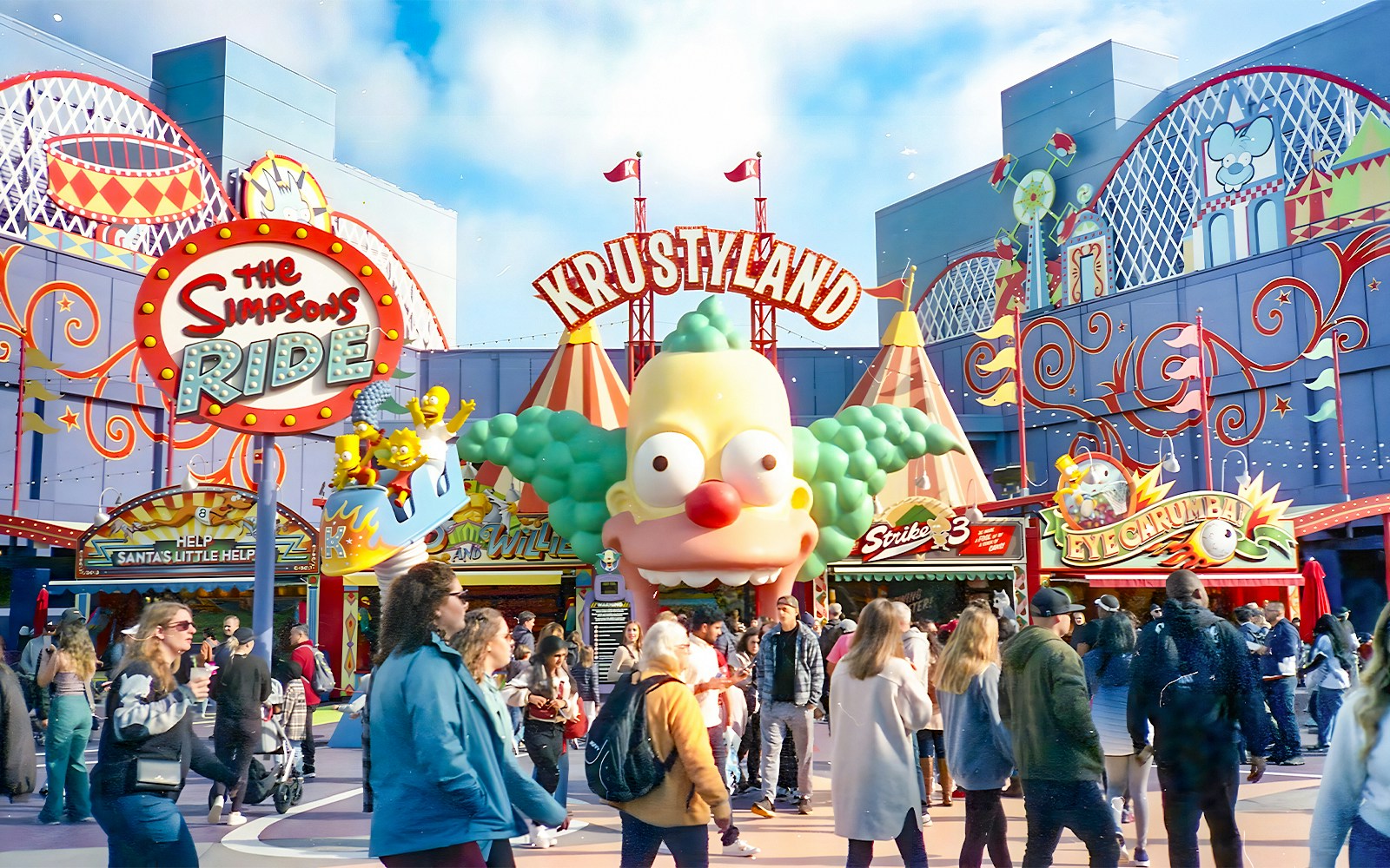Krustyland entrance at Universal Studios Orlando with The Simpsons Ride sign and visitors.