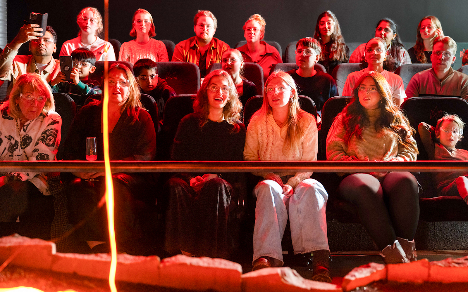 Guests watching a lava show in Reykjavik theater.