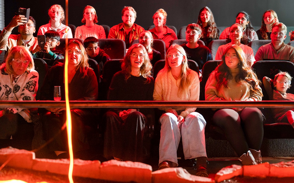 Guests watching a lava show in Reykjavik theater.