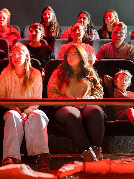 Guests watching a lava show in Reykjavik theater.