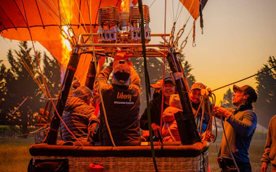 Liberty Balloon Flights crew preparing hot air balloon for ride, Geelong, Australia.
