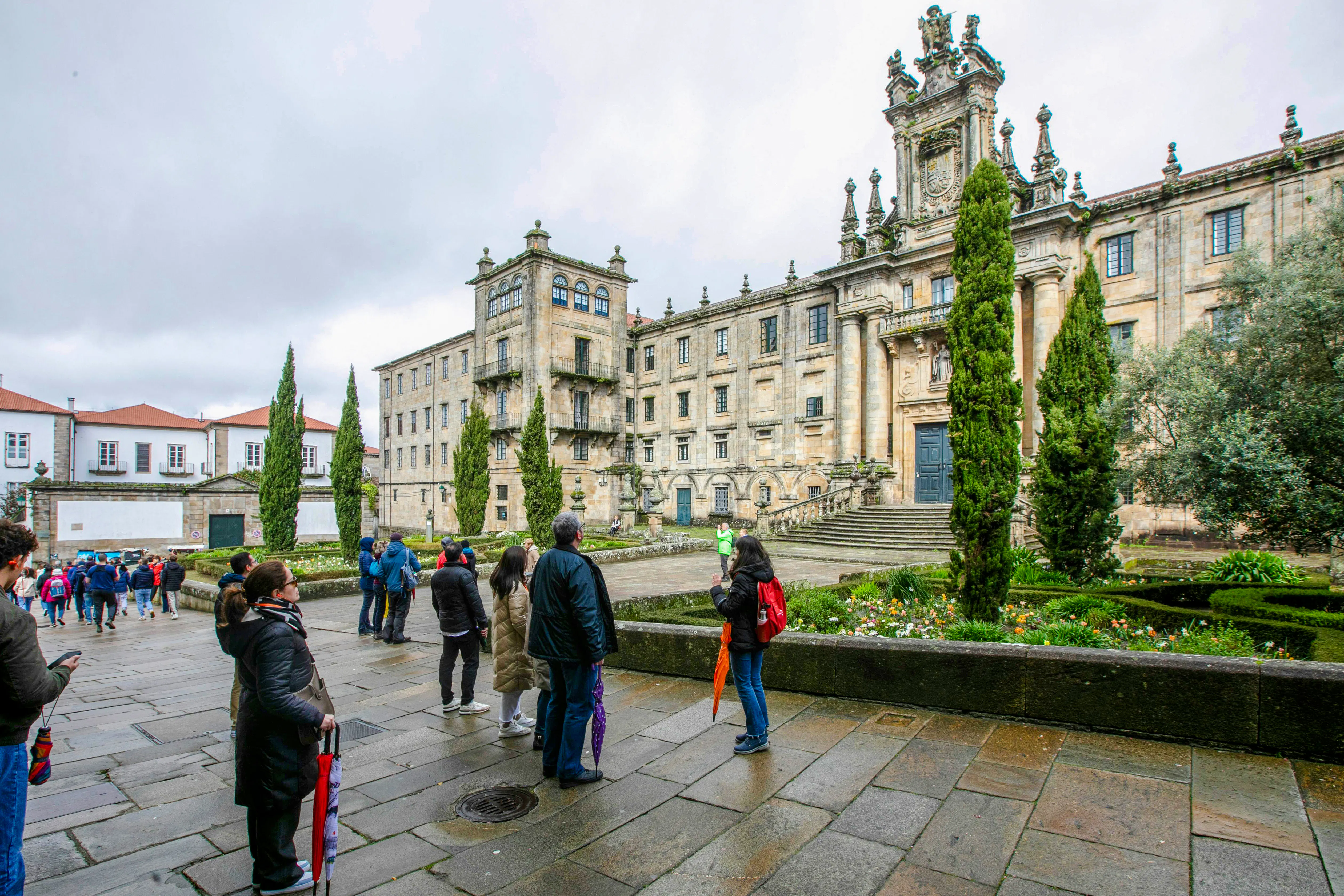 Visitors outside the Monastery of San Martiño Pinario, Santiago de Compostela, Spain.