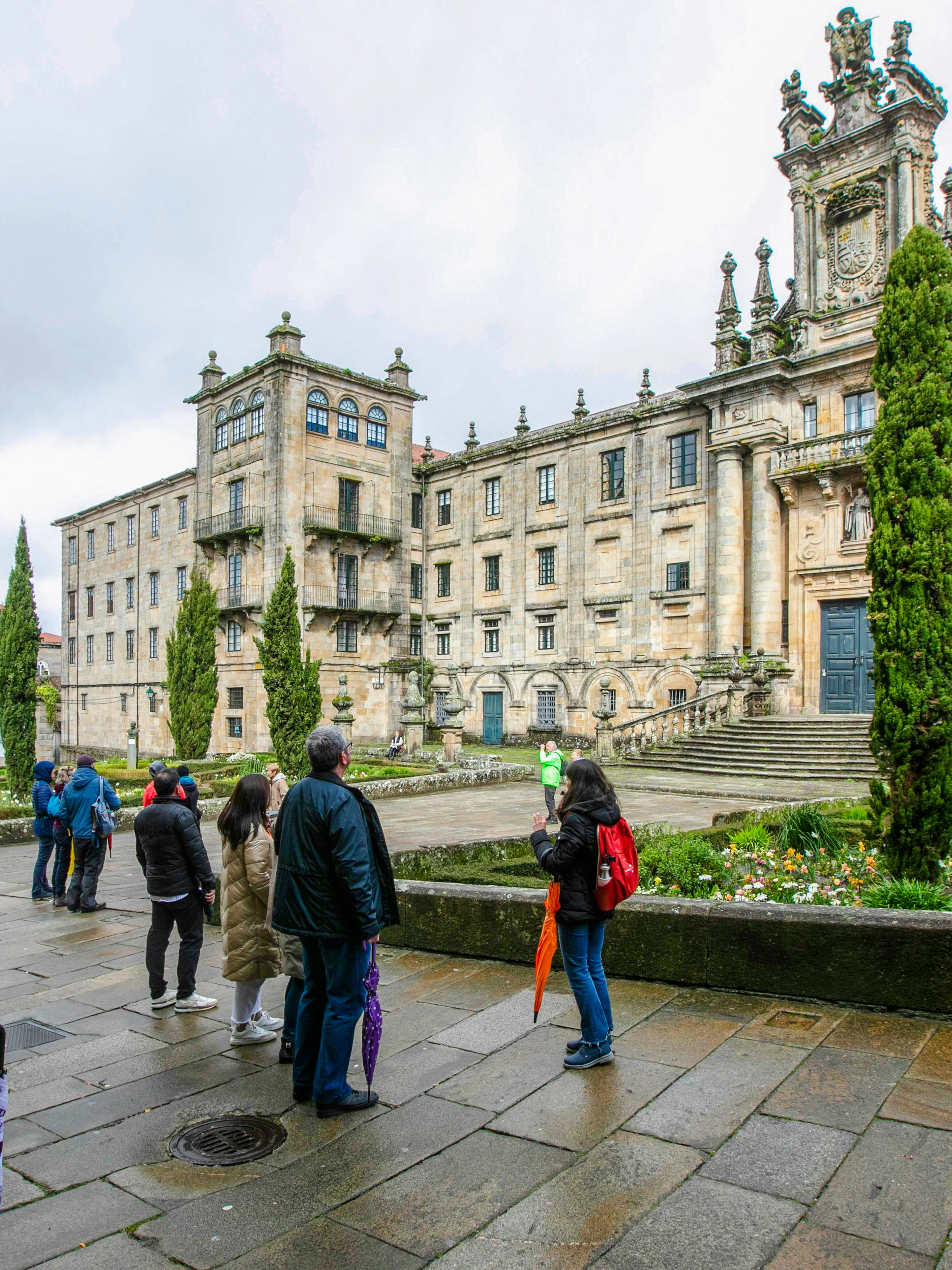 Visitors outside the Monastery of San Martiño Pinario, Santiago de Compostela, Spain.