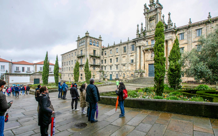 Visitors outside the Monastery of San Martiño Pinario, Santiago de Compostela, Spain.