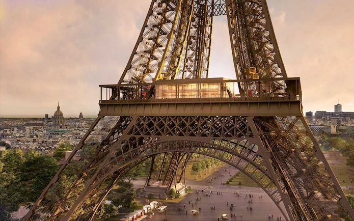 Eiffel Tower's Madame Brasserie exterior with Paris skyline in the background.