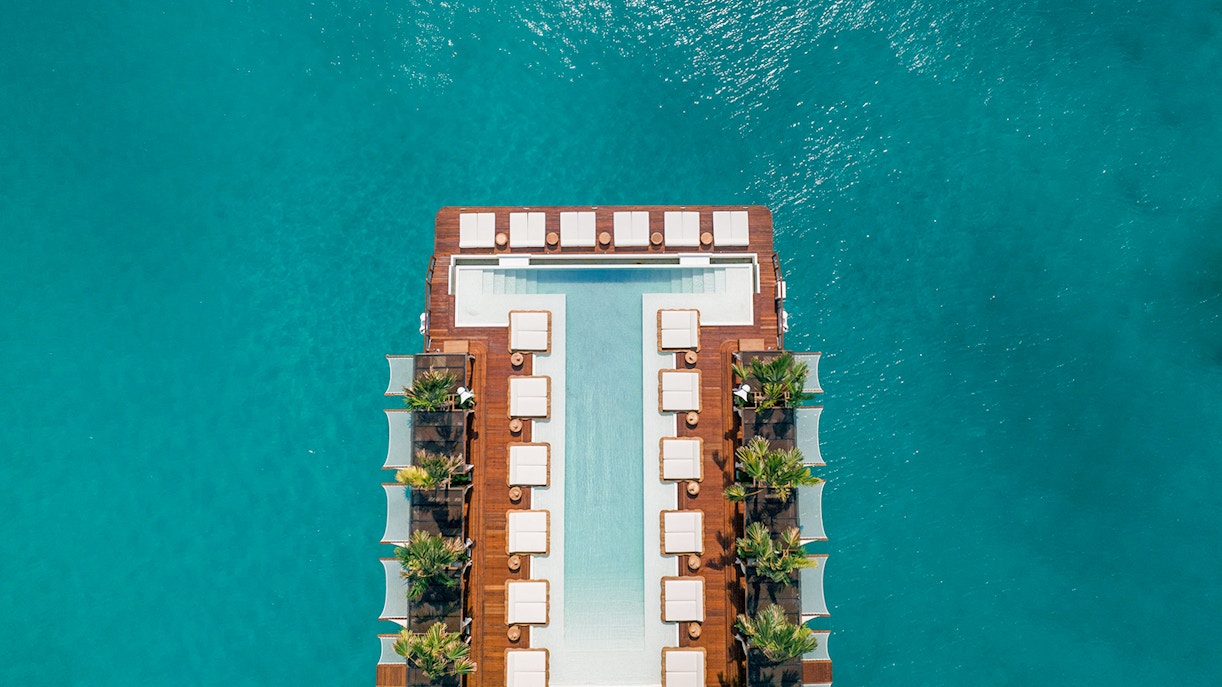 Visitors enjoying the sunset at Yona Beach Club Experience in Phuket, offering exclusive access to a stunning terrace view
