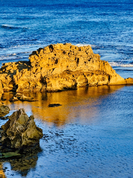 Blowholes and rock formations along Phillip Island's coastline.