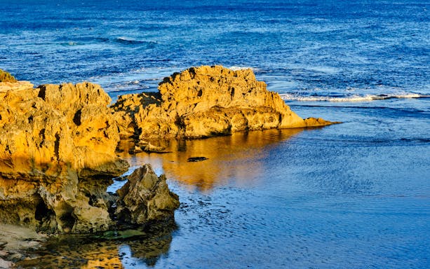 Blowholes and rock formations along Phillip Island's coastline.