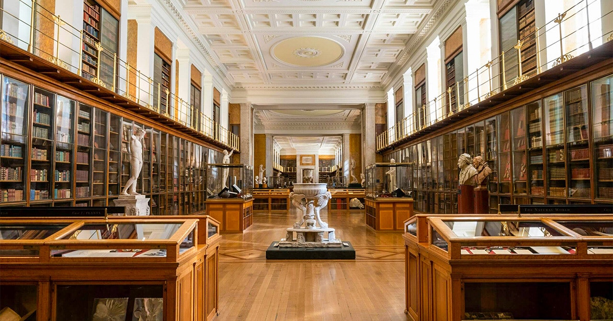British Museum Enlightenment Room with statues and display cases.