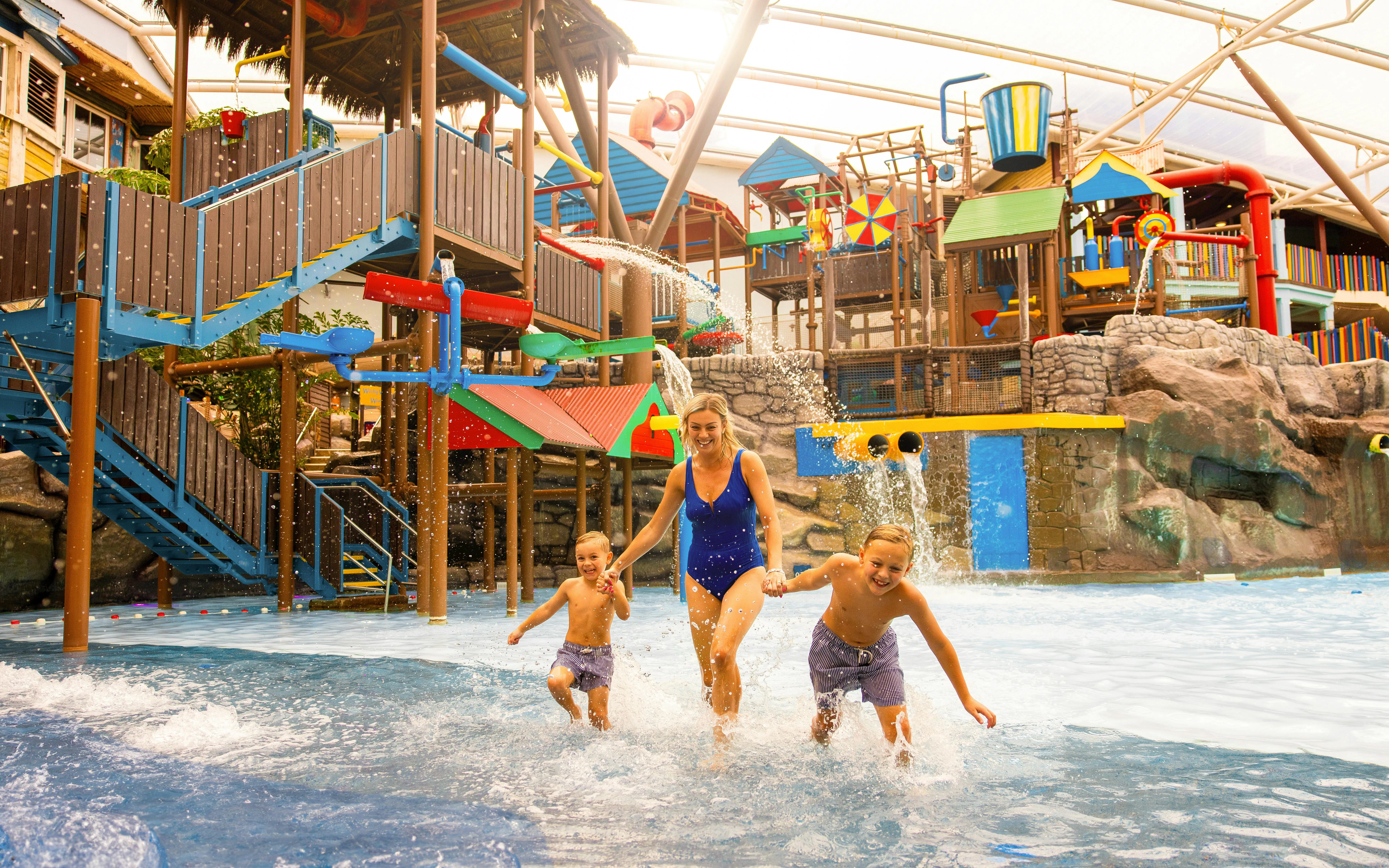 Family enjoying water play area at Alton Towers Waterpark.