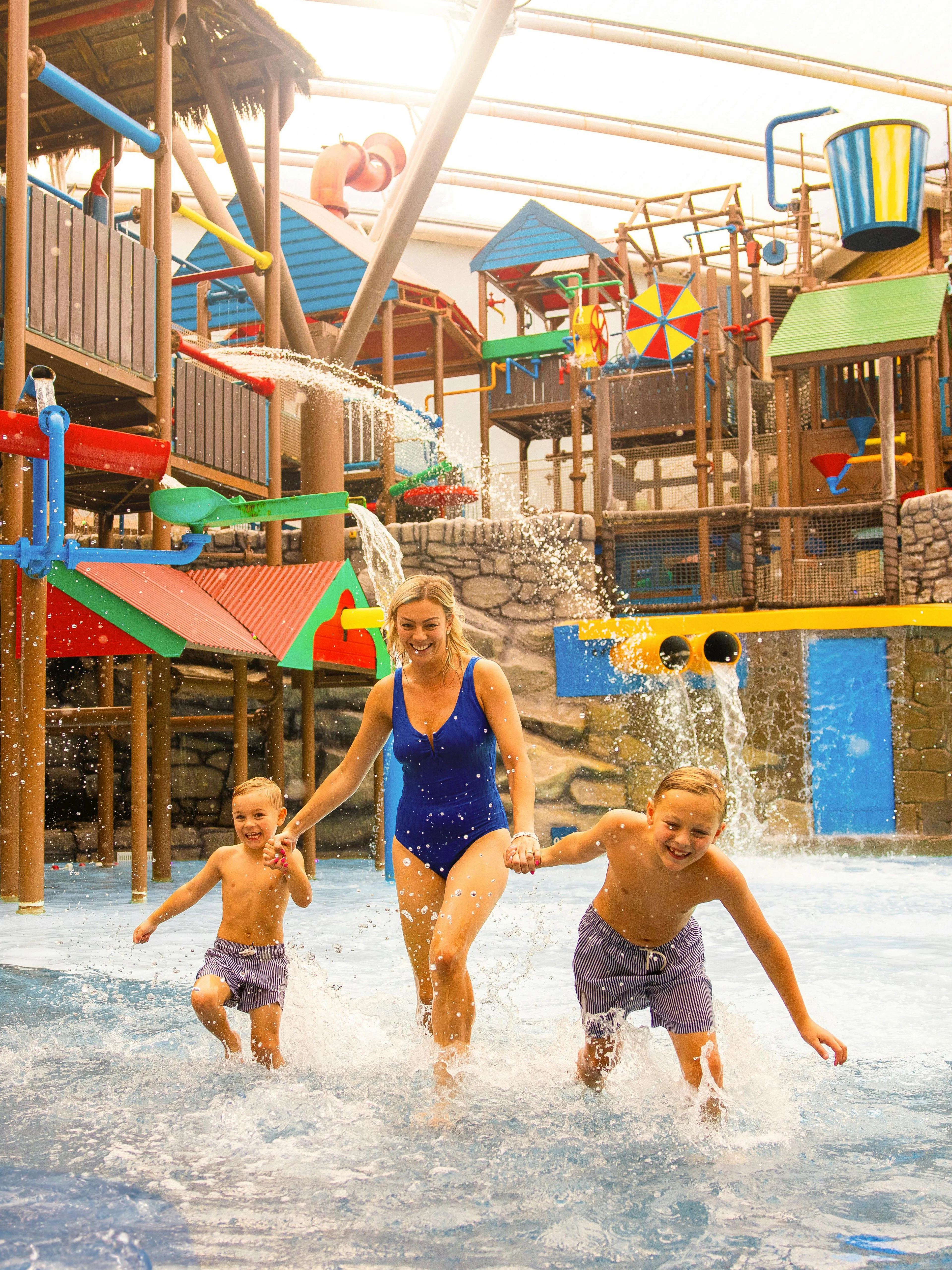 Family enjoying water play area at Alton Towers Waterpark.