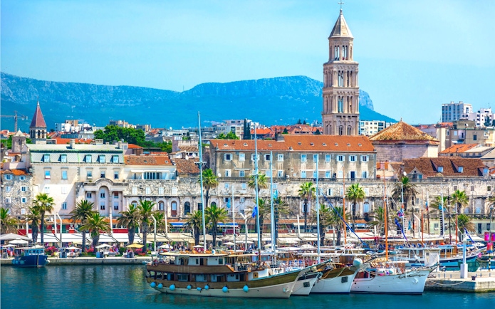 Seafront view of Diocletian's Palace and boats in Split, Croatia.