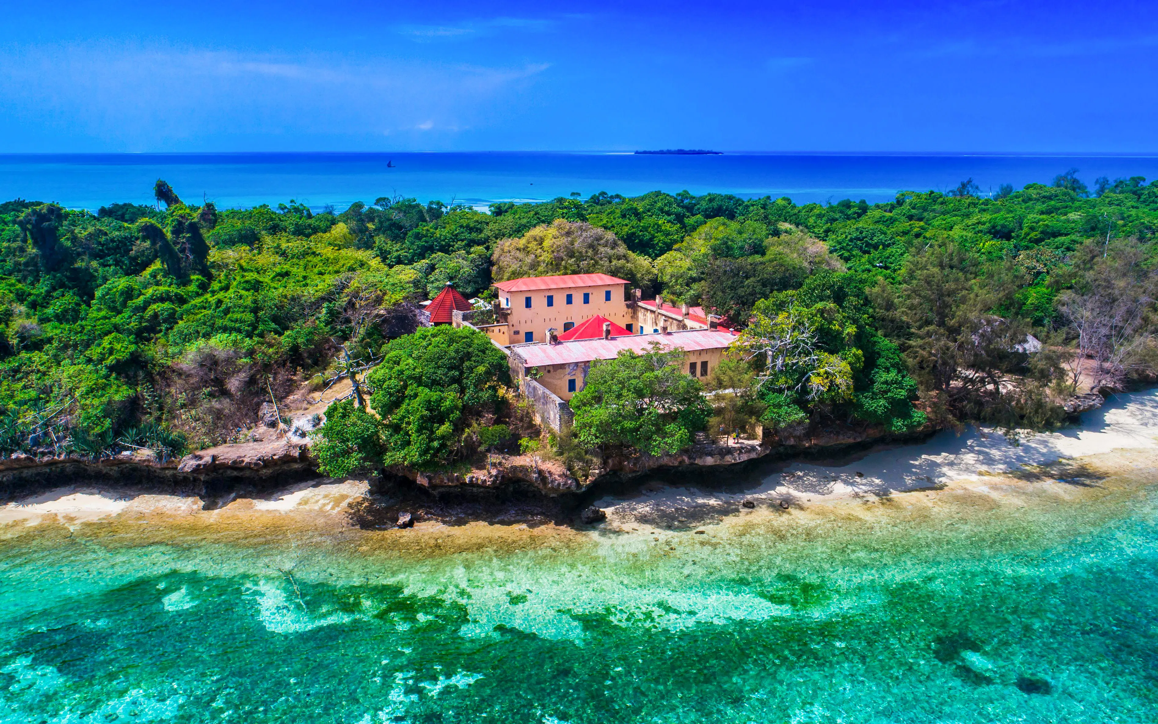 Aerial view of Prison Island surrounded by turquoise waters and lush greenery, Zanzibar, Tanzania.