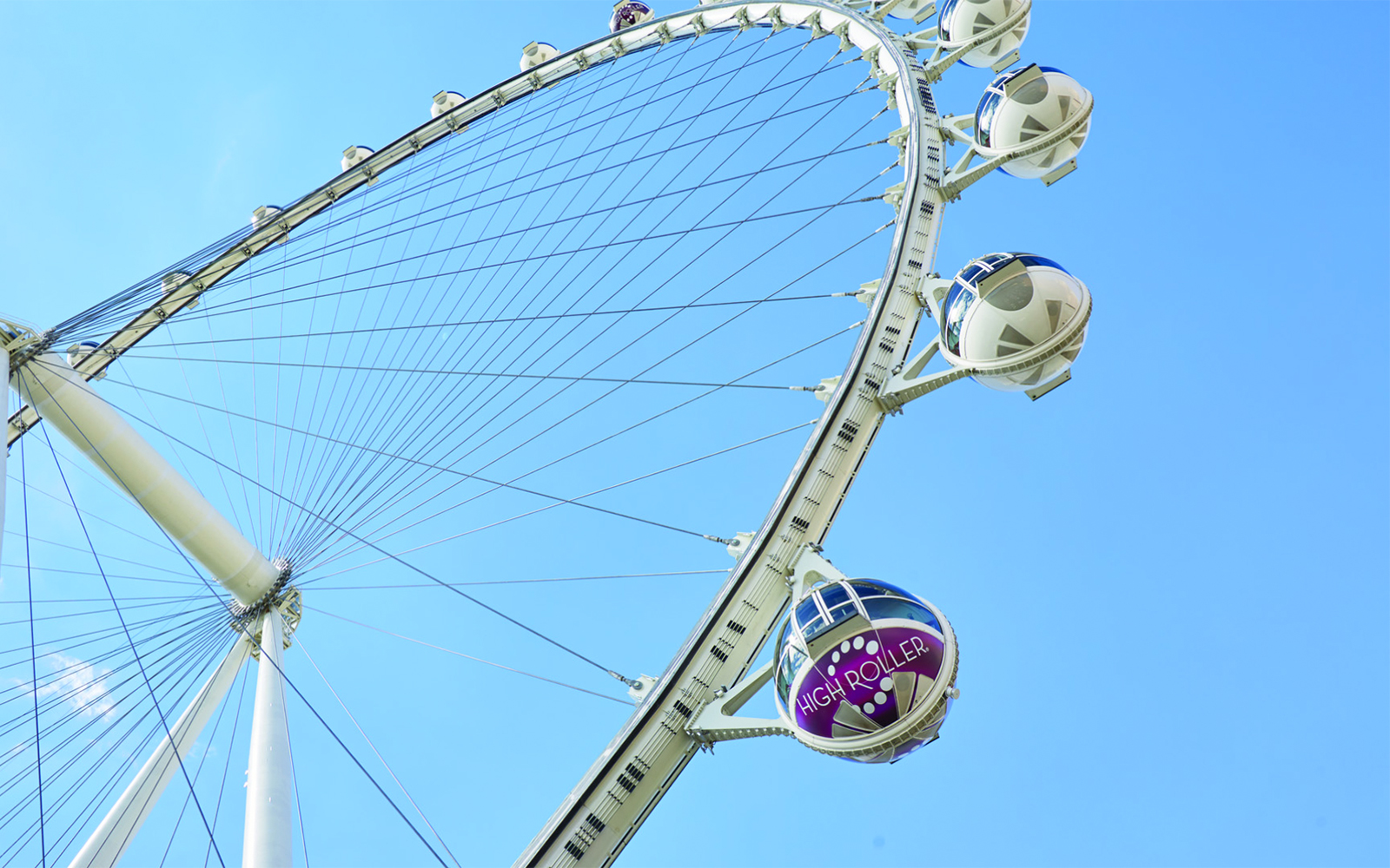 Las Vegas High Roller Observation Wheel against blue sky.