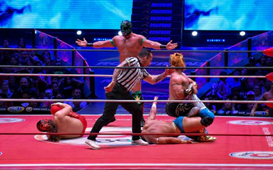 Wrestlers in action at Arena Mexico Lucha Libre event.
