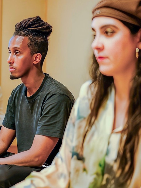 Tourists participating in a private tea ceremony with seasonal wagashi in a traditional Japanese room.