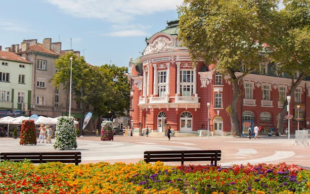 Varna Drama Theatre with colorful flowers in Varna, Bulgaria.