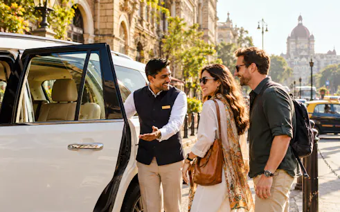 Tourists entering a car for Mumbai Private Shopping Express with guide in Agra.