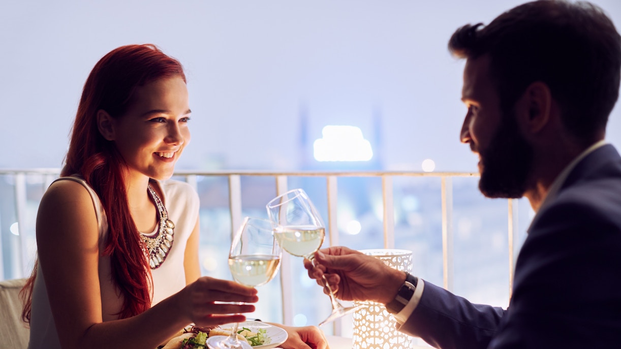 Couple dining at a restaurant in Paris, France.