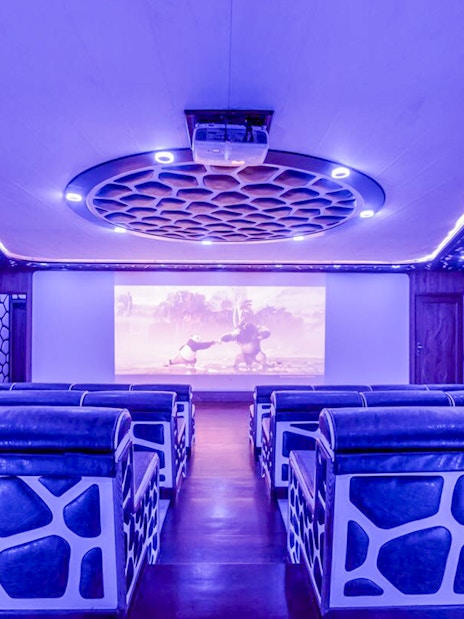 Luxury cinema room on a mega yacht dinner cruise in Dubai.