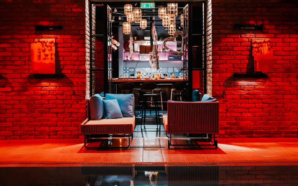 Mandala Day Spa lounge area with seating and ambient lighting.