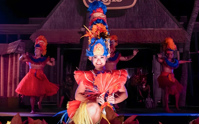 Dancers in traditional attire performing at Germaine's Luau.