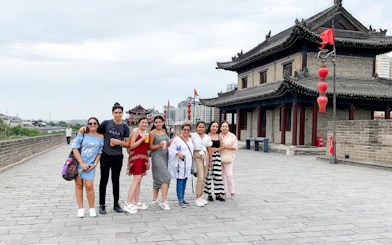 Group of tourists on Xian City Wall during guided tour from Chengdu.