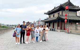 Group of tourists on Xian City Wall during guided tour from Chengdu.