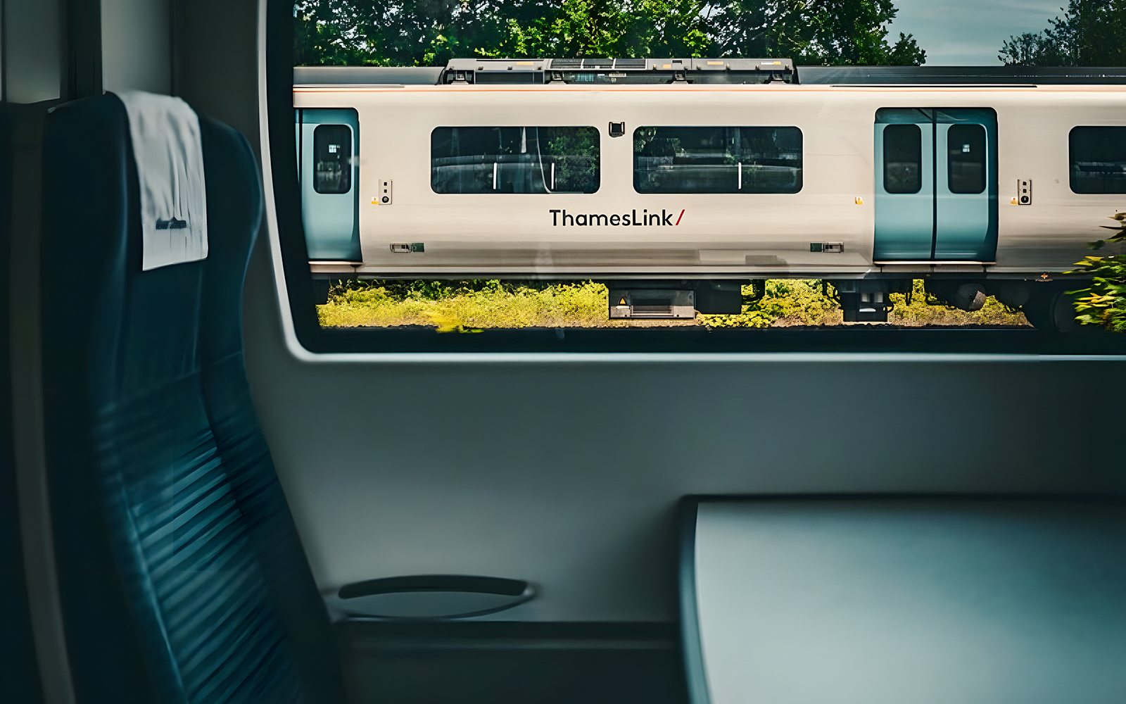 View from inside a train on the London St Pancras International route, showing ThamesLink train passing by.