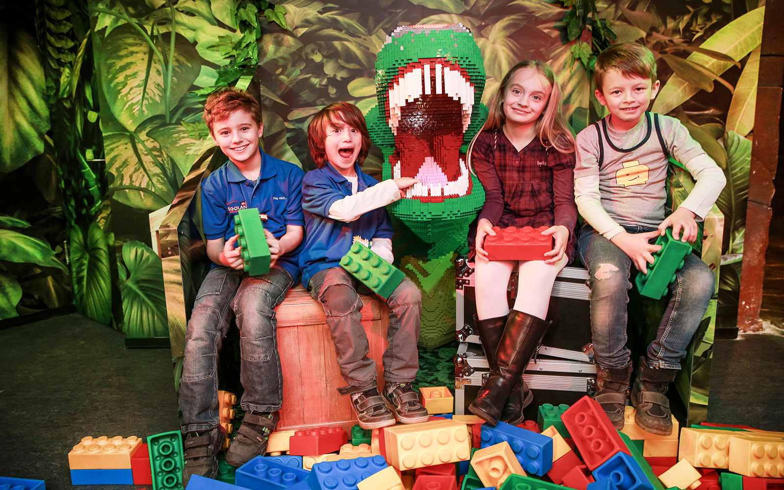 Kids with Lego dinosaur at Berlin Legoland Discovery Centre.