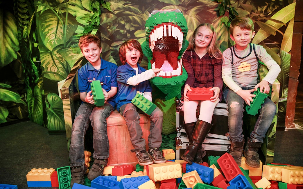 Kids with Lego dinosaur at Berlin Legoland Discovery Centre.