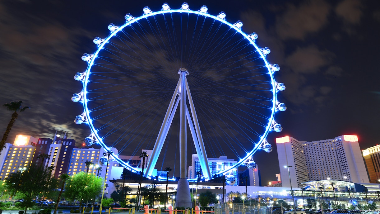 High Roller Observation Wheel illuminated at night in Las Vegas, offering panoramic city views.